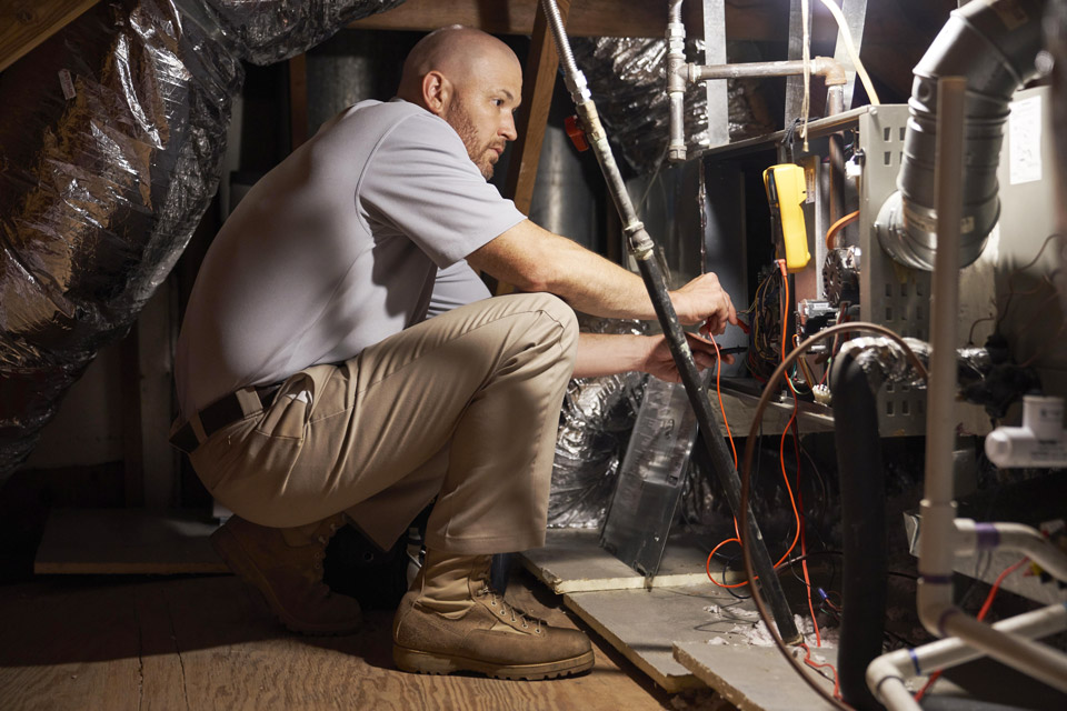 Service technician at a furnace